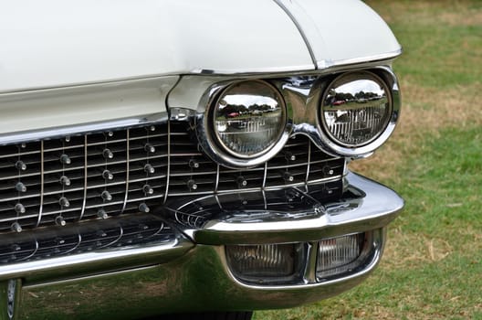 Headlight and radiator grill on classic car