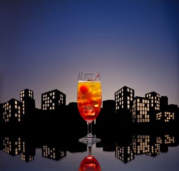 Metropolis Tequila Sunrise cocktail in city skyline setting