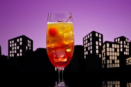 Metropolis Tequila Sunrise cocktail in city skyline setting