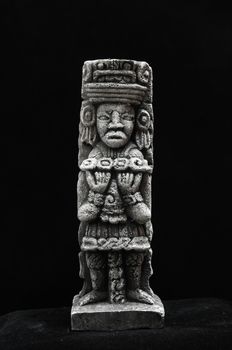 One Ancient Mayan Statue on a Black Background