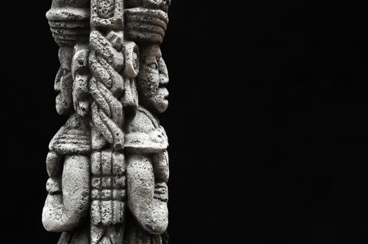 One Ancient Mayan Statue on a Black Background