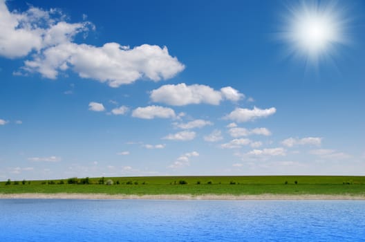 river with cloudy sky and sun