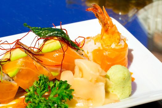 Spicy Sushi salmon Roll with Shrimps,  Japanese Cuisine (selective focus at front)