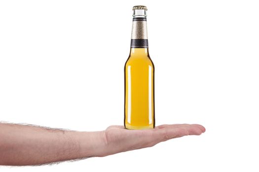 A bottle of beer in the palm of a hand.