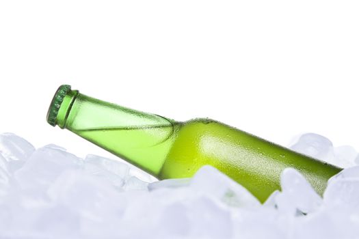 A bottle of beer buried on ice.