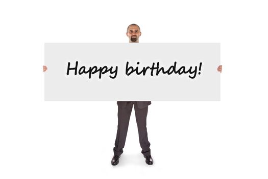 Smiling businessman holding a really big card, isolated on white, happy birthday