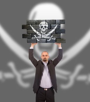 Businessman holding a large piece of a brick wall, pirate sign, isolated