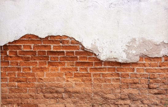 Red brick wall Old cracked concrete vintage brick wall background.