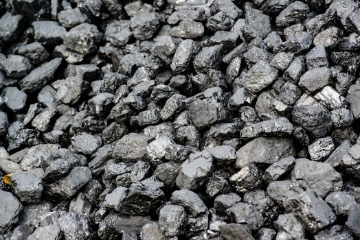 A pile of black coal from mining pit - background