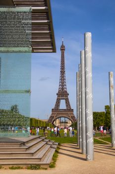 Eiffel tower in Paris with sculpture of peace