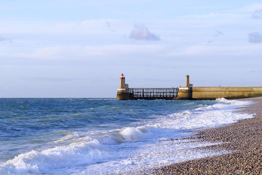 lighthouse ,blue ocean and beach