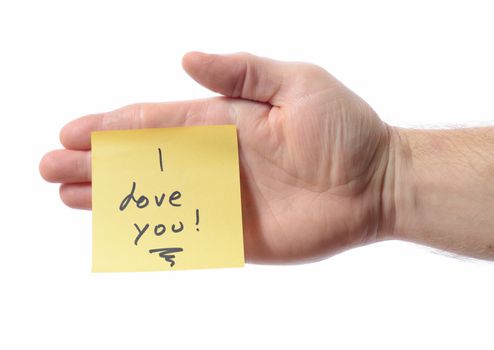 Post it note on hand saying i love you