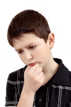 pensive young boy with hand on head isolated on white background