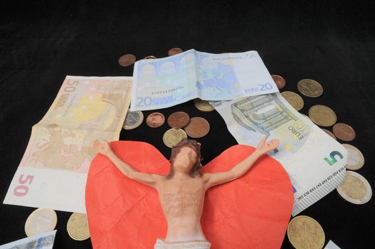 Jesus Christ and Money on a Dark Background - Religion Concept