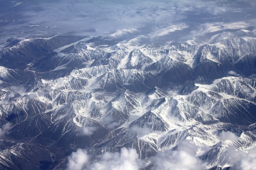 Mountains in the spring: view from height. Chersky Range. Siberia.