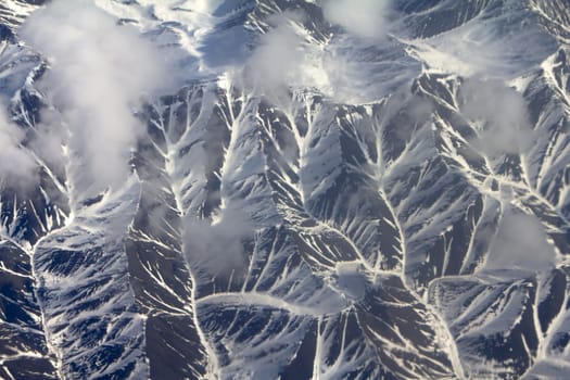 Mountains in the spring: view from height. Chersky Range. Siberia.