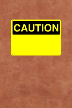 A blank caution sign mounted on a wall