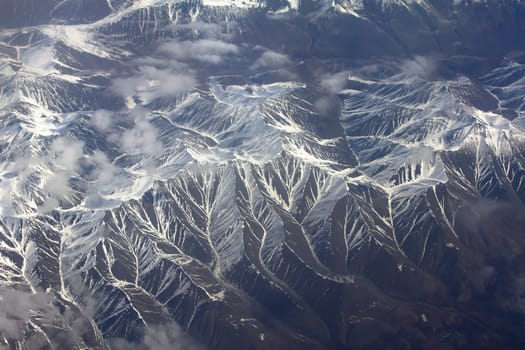 Mountains in the spring: view from height. Chersky Range. Siberia.