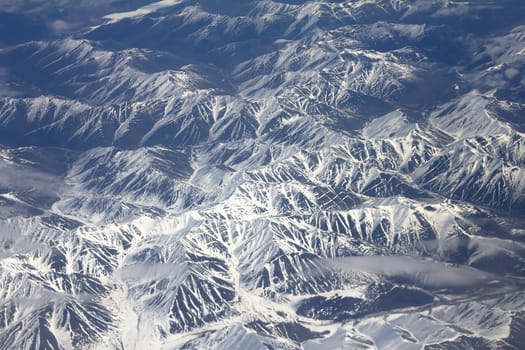 Mountains in the spring: view from height. Chersky Range. Siberia.