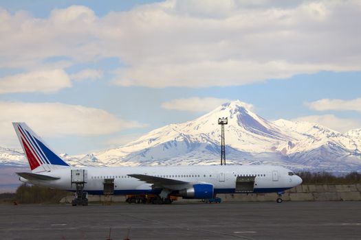 The plane against the Avacha volcano. Kamchatka. Petropavlovsk-Kamchatsky.
