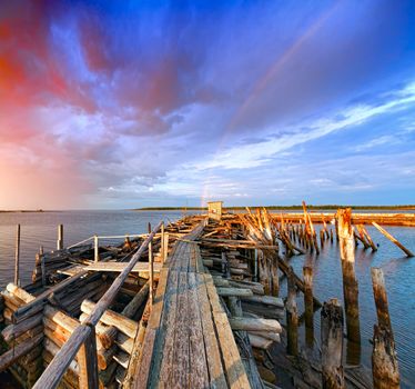 Old wooden pier at sunset. White Sea; Karelia; Russia