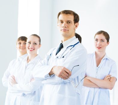 team of experienced highly qualified doctors, fold one's arms