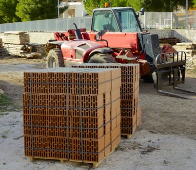blocks bricks waiting to be moved with a crane trucks