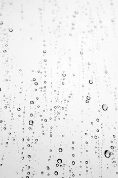 Drops of rain on the inclined window (glass). Shallow DOF.