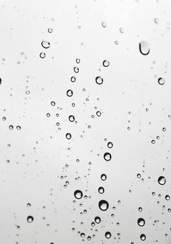 Drops of rain on the inclined window (glass). Shallow DOF.