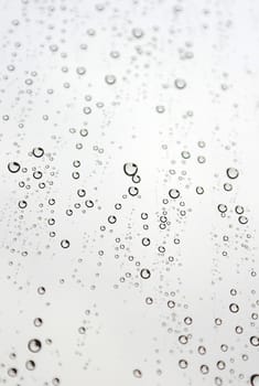 Drops of rain on the inclined window (glass). Shallow DOF.