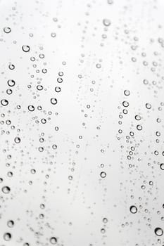 Drops of rain on the inclined window (glass). Shallow DOF.