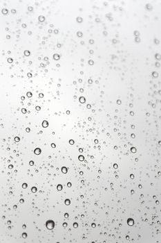 Drops of rain on the inclined window (glass). Shallow DOF.