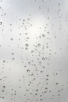 Drops of rain on the inclined window (glass). Shallow DOF.