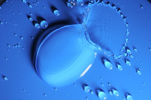 Some Water Drops on a Blue Textured Background