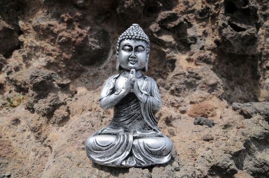 One Ancient Gray Buddha Statue Near The Ocean