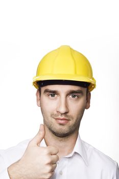 young male engineer with thumb up, over white background