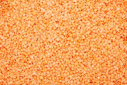 Red lentils abstract background texture