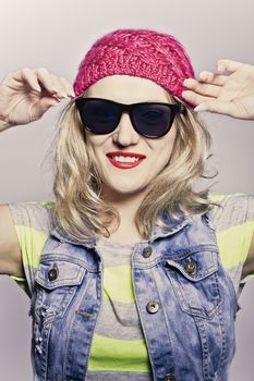 young girl in a pink covering posing