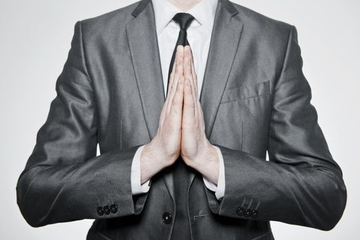  hands of businessman set in pray