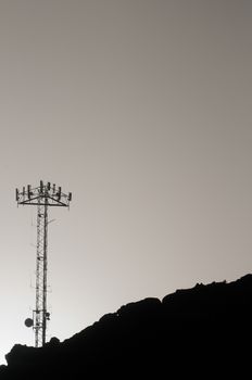 Some Silhouetted Antennas on the top of a Hill