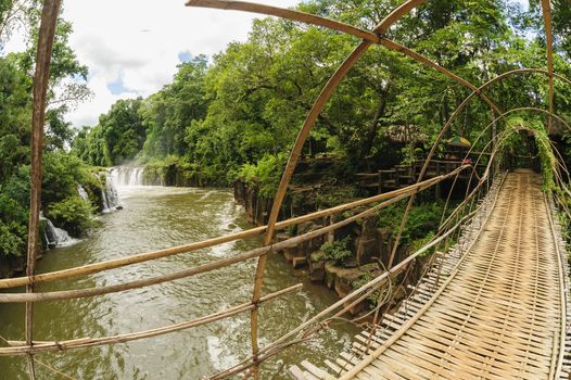 The bamboo rope bridge in Tad Pha Souam waterfall Bajeng national park, Paksa South Laos