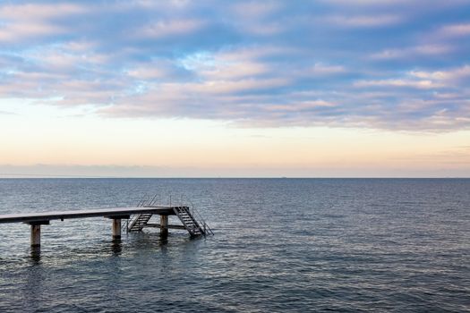 Boat pier at Øresund with a beautiful sunset sky. Malmo, Sweden