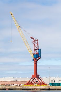 Photo of a crane at a cargo dock.