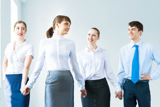 leadership team, a group of business people standing in a number of hand-in-hand, the leader stepped forward