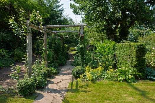 Beautiful gardening project - creative garden tunnel archway in a classical garden