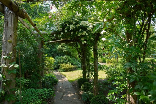 Beautiful gardening project - creative garden tunnel archway in a classical garden