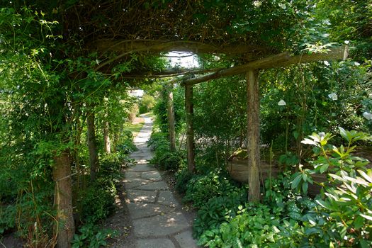 Beautiful gardening project - creative garden tunnel archway in a classical garden