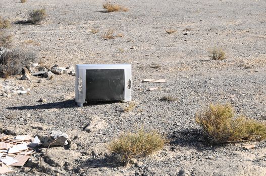 A Broken Gray Television Abandoned in the Desert