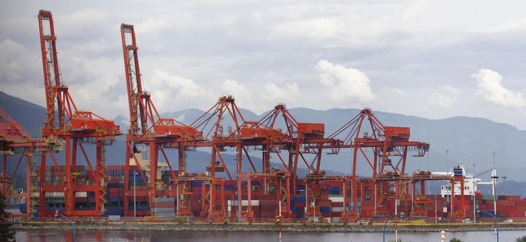 Port of Vancouver BC Canada with Red Cranes and Shipping Containers at Shipyard Panorama