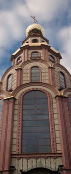 Element of the building of the Orthodox cathedral against the blue sky with clouds in Krivoy Rog in Ukraine